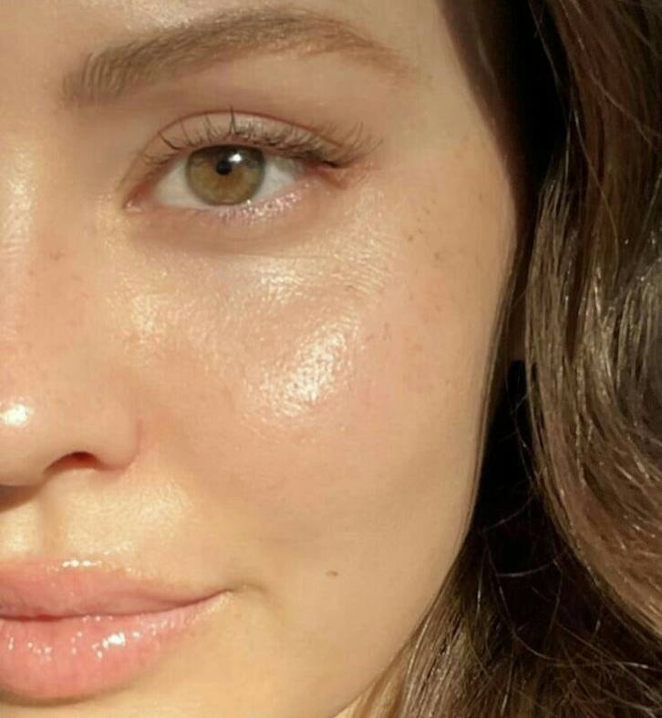 Close-up of a person's face with a soft focus on the skin texture.